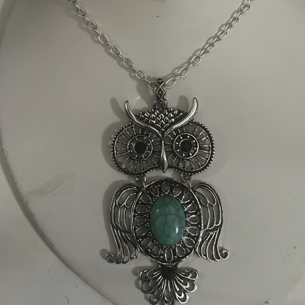 Silver plated owl pendant with turquoise stone